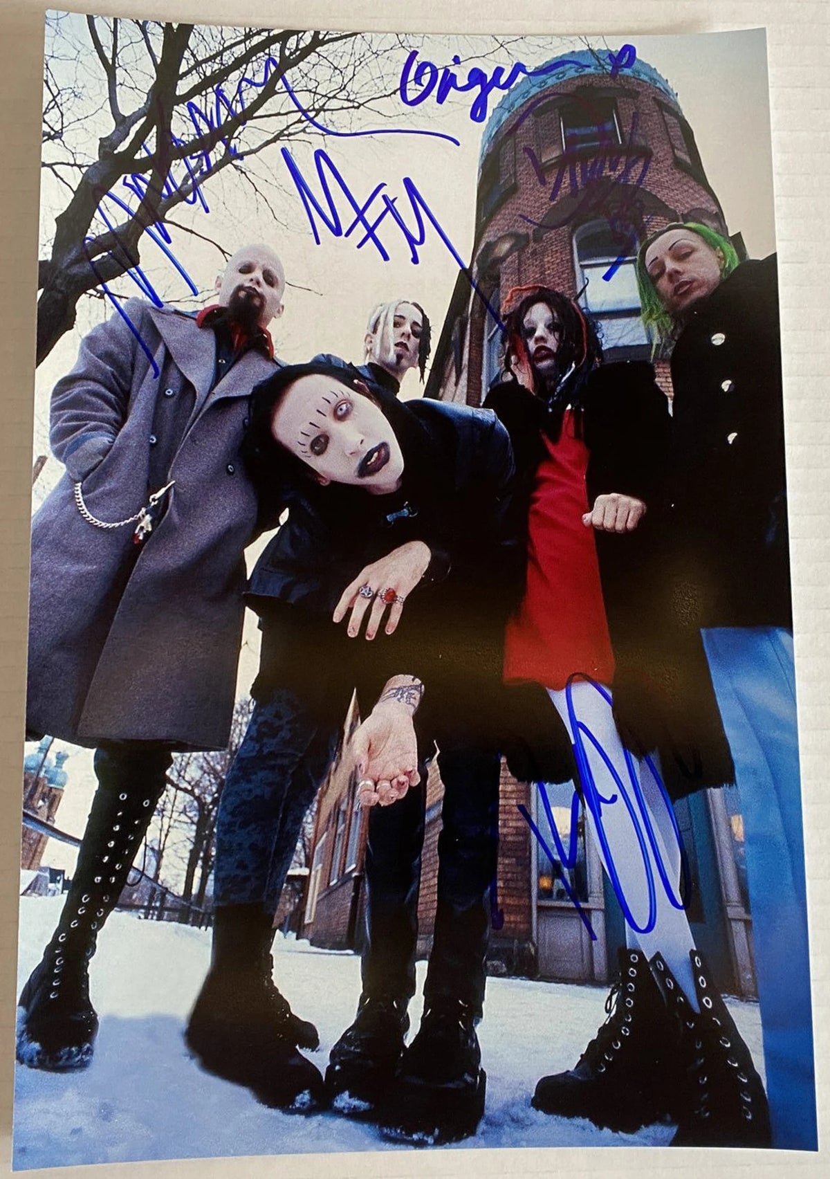 A cast autographed poster of the band, Marilyn Manson. Signed photo of Marilyn Manson, Daisy Berkowitz, Twiggy Ramirez, Madonna Wayne Gacy and Ginger Fish in blue ink markers. Photograph autographs for sale on 8x12 inch picture.
