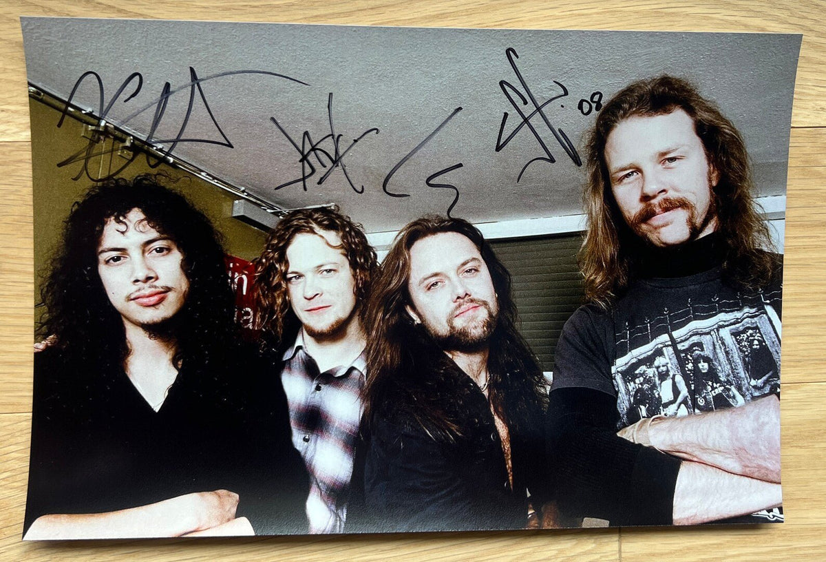 An autographed poster of heavy metal band, Metallica. Signed photo of James Hetfield, Kirk Hammett, Lars Ulrich and Jason Newsted in black ink marker signatures. Photograph autographs for sale on 8x12 inch picture.