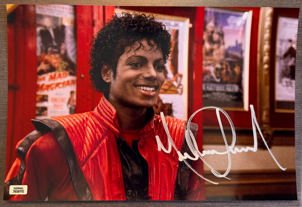 An autographed poster of Michael Jackson in his Thriller costume and movie. Signed Michael Jackson thriller photo in silver ink marker signatures. Photograph autographs for sale on 8x12 inch picture.