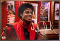 An autographed poster of Michael Jackson in his Thriller costume and movie. Signed Michael Jackson thriller photo in silver ink marker signatures. Photograph autographs for sale on 8x12 inch picture.