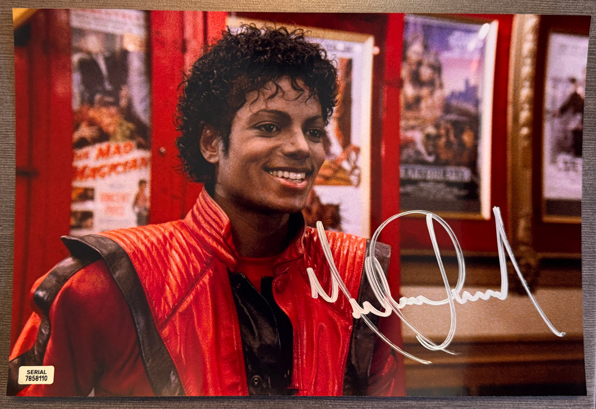 An autographed poster of Michael Jackson in his Thriller costume and movie. Signed Michael Jackson thriller photo in silver ink marker signatures. Photograph autographs for sale on 8x12 inch picture.
