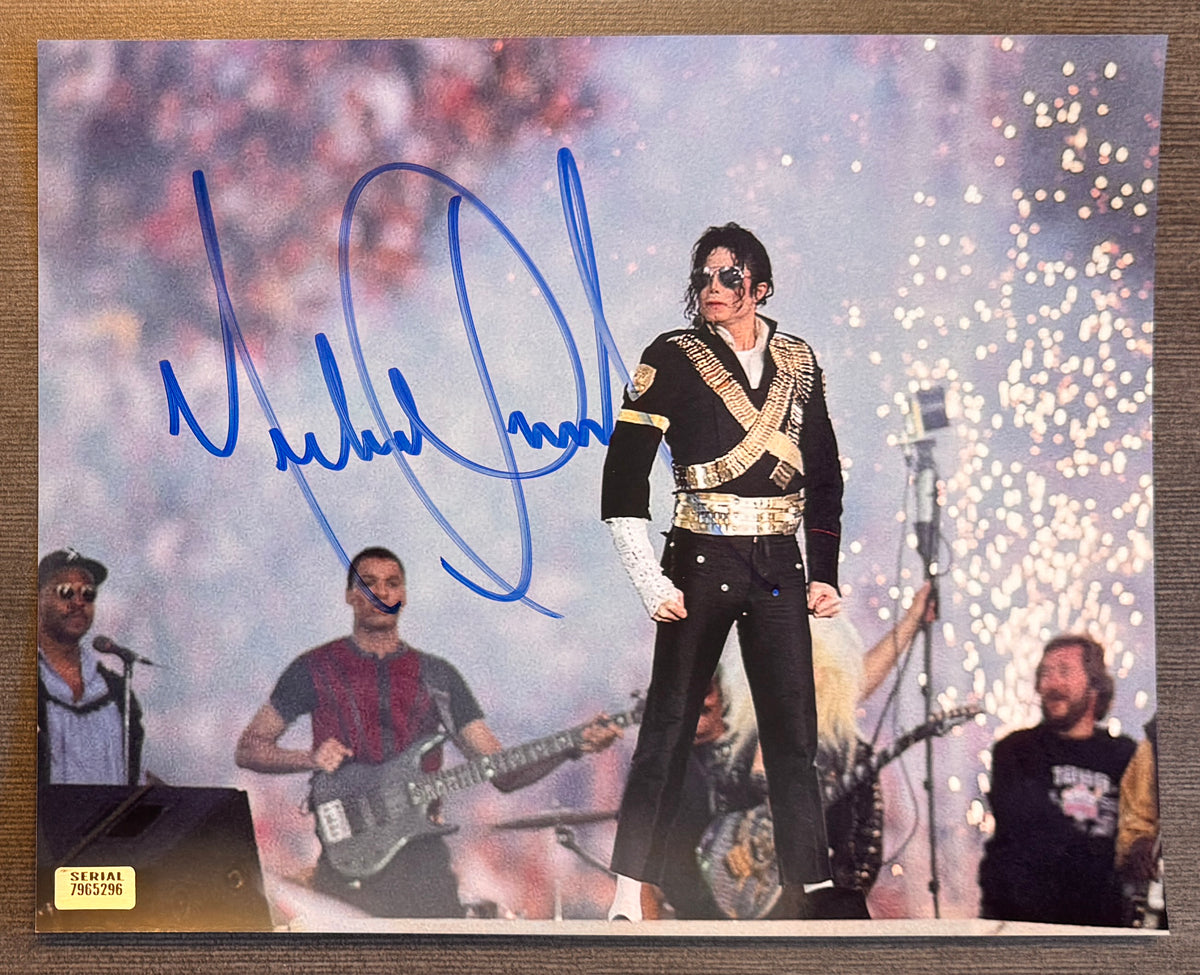 An autographed 8x10 photograph of Michael Jackson performing on stage, signed in blue ink across the center. photograph autographs for sale on 8x12 inch picture poster.