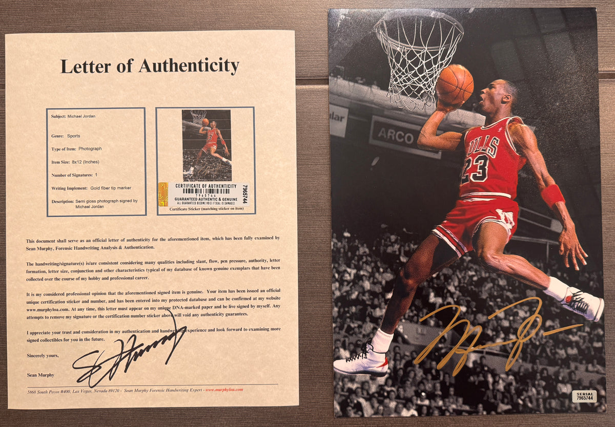 An autographed nba Chicago Bulls upper deck auto photo poster of Michael Jordan. Signed photograph in gold ink marker signatures. Photograph Michael Jordan autographs for sale on 8x12 inch picture with COA.