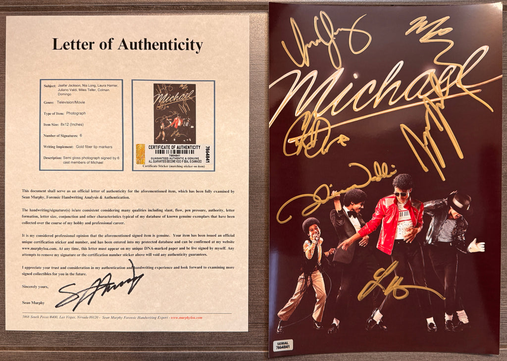 An autographed Michael Jackson poster featuring the four members of the Jackson 5 performing, signed in gold marker with 'Michael' and other signatures across the top, set against a dark background. autograph by Jaafar Jackson, Nia Long, Laura Harrier, Juliano Valdi, Miles Teller and Colman Domingo in gold marker. signed on an 8x12 inch photograph photo autographs for sale with COA.