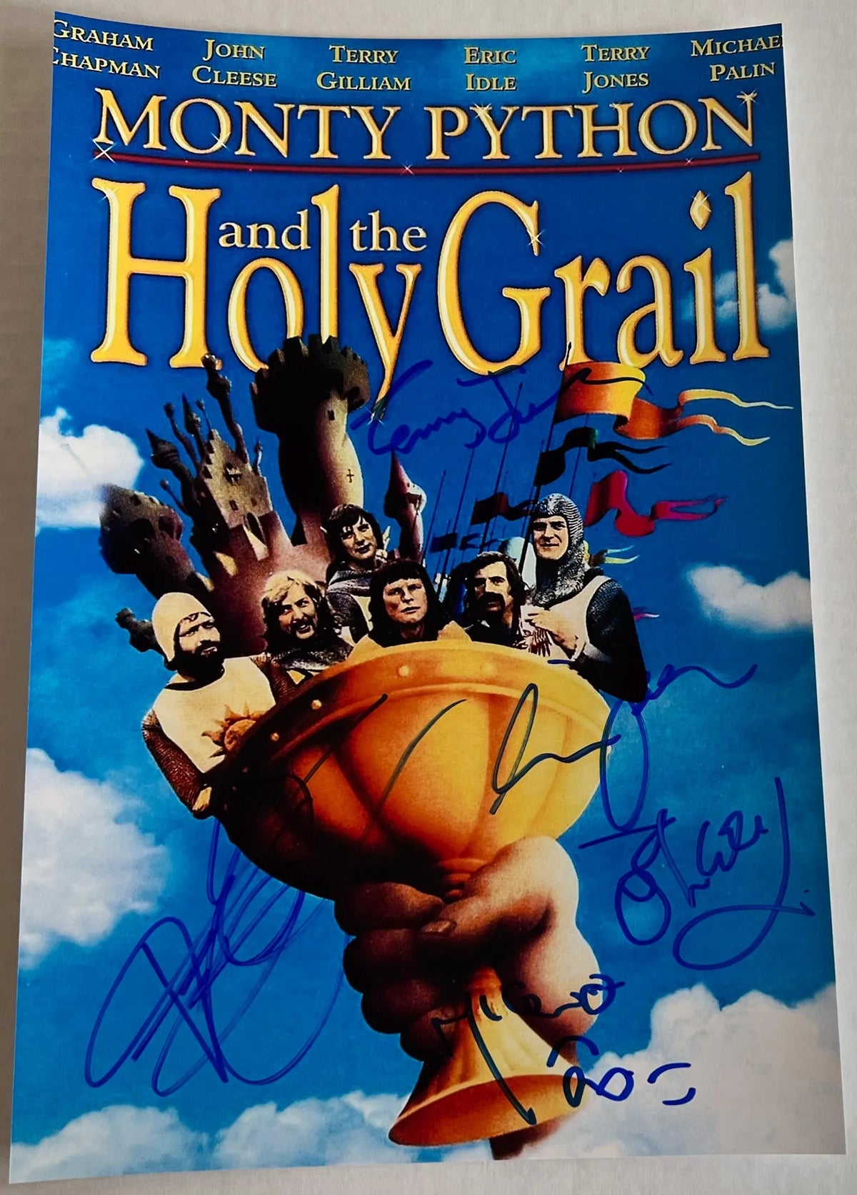 A cast autographed poster from the movie Monty Python and the Holy Grail. Signed photo of John Cleese, Eric Idle, Terry Gilliam, Terry Jones and Michael Palin in blue ink marker signatures. Photograph autographs for sale on 8x12 inch picture.
