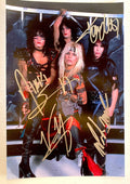 an autographed photo of the band Motley Crue. Signed poster by Nikki Sixx, Tommy Lee, Mick Mars and Vince Neil in silver ink markers. photograph autographs for sale on 8x12 inch picture.