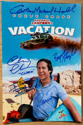 A cast autographed photo poster from the movie,  National Lampoon's Vacation. Signed photo of Chevy Chase, Beverly D'Angelo, Randy Quaid, Anthony Michael Hall and Dana Barron in blue ink markers signatures. Photograph Chevy Chase autographs for sale on 8x12 inch picture.