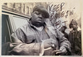 An autographed photo poster of the hip hop rapper, Notorious B.I.G. also spelled as BIG. Signed photo and inscribed in black ink marker signatures. Photograph Notorious B.I.G. autographs for sale on 8x12 inch picture.