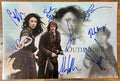 An autographed poster of the television series Outlander. Signed photo of Sam Heughan, Caitriona Balfe, Duncan Lacroix, Tobias Menzies, Grant O'Rourke, Graham McTavish, Stephen Walters, Romann Berrux and Andrew Gower in blue ink marker signatures. Photograph Outlander autographs for sale on 8x12 inch picture.