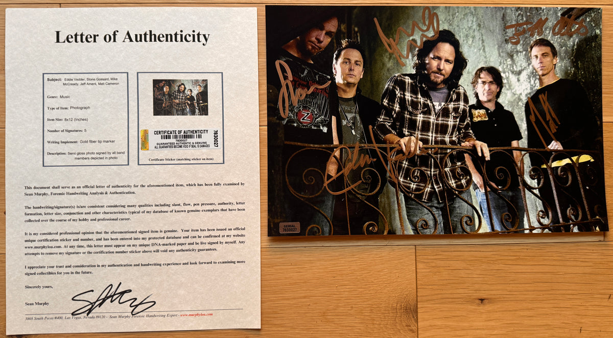 An autographed poster of rock band, Pearl Jam. Signed photo of Eddie Vedder, Mike McCready, Stone Gossard, Jeff Ament and Matt Cameron in gold ink marker signatures. Photograph autographs for sale on 8x12 inch picture with COA.