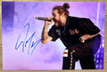photograph signed by rapper and hip hop artist, Post Malone. autograph in blue ink on an 8x12 inch photograph. Post Malone autographs for sale.