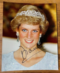 An autographed photo print of Princess Diana wearing a silver tiara and earrings, signed in black ink across the lower portion. signed in black ink autograph. photograph poster is 8x10 inches Princess Diana autographs for sale.