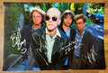 An autographed poster of the rock band, R.E.M. also known as REM. Signed photo of Michael Stipe, Mike Mills, Peter Buck and Bill Berry in silver ink marker signatures. Photograph autographs for sale on 8x12 inch picture.