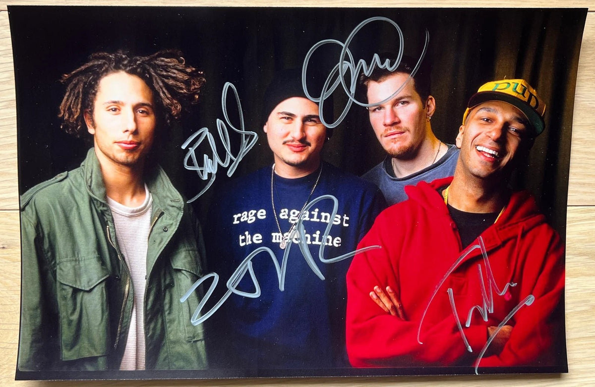 An autographed photo poster of the band, Rage Against the Machine. Signed poster of Zack De La Rocha, Tom Morello, Tim Commerford and Brad Wilk in silver ink markers signatures. Photograph Rage Against The Machine autographs for sale on 8x12 inch picture.