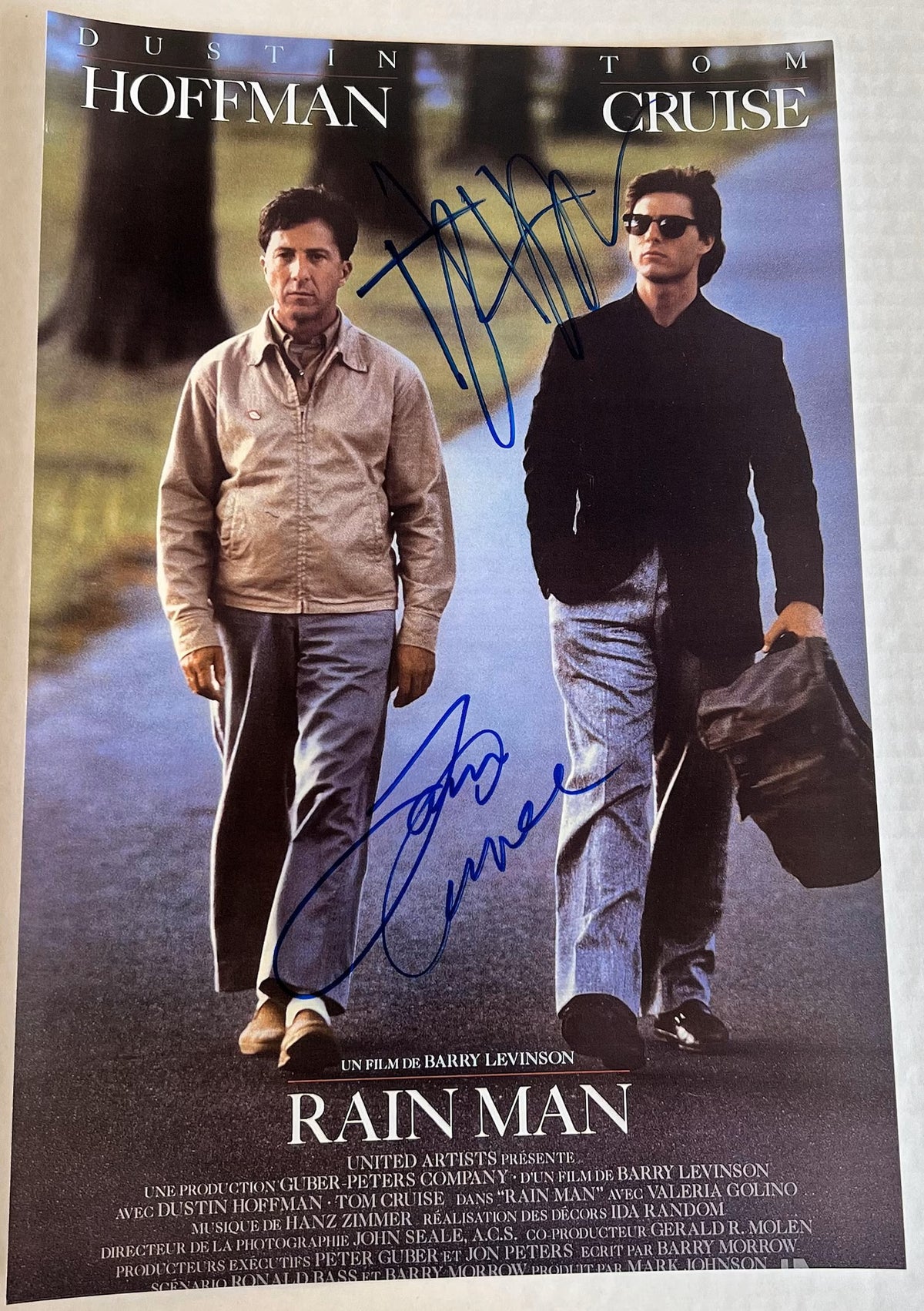 A cast autographed photo poster from the movie, Rain Man. Signed photo of Tom Cruise and Dustin Hoffman in blue ink marker signatures. Photograph Tom Cruise autographs for sale on 8x12 inch picture.