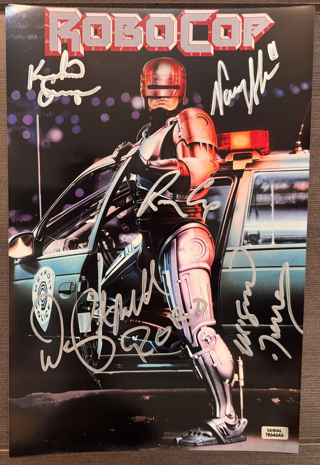 A cast autographed photo poster from the movie, Robocop. Signed photo of Peter Weller, Nancy Allen, Ronny Cox, Kurtwood Smith and Miguel Ferrer in silver ink marker signatures. Photograph robocop autographs for sale on 8x12 inch picture.