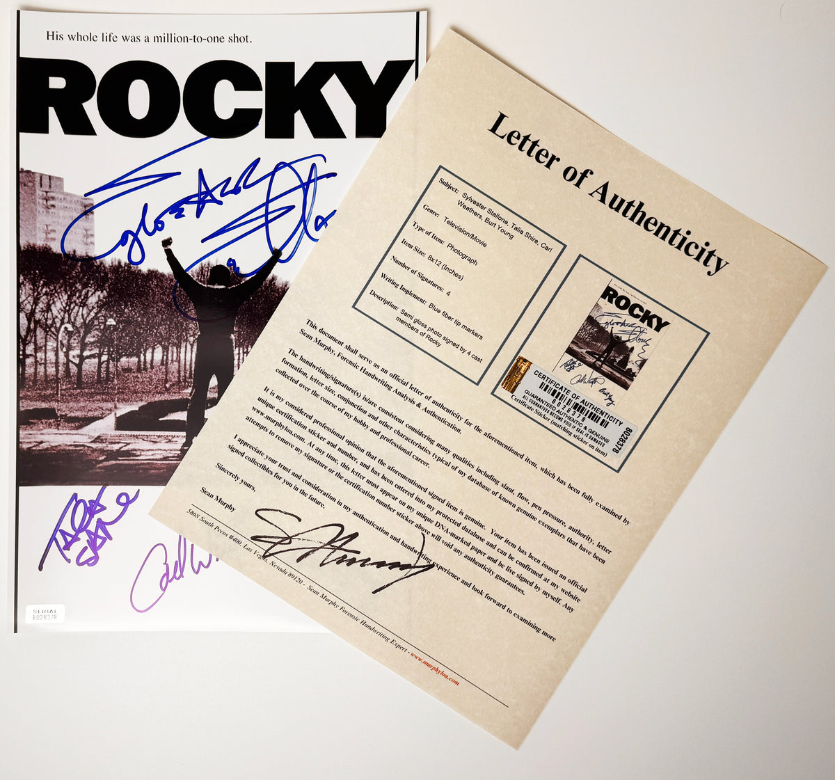 An autographed movie poster of the 1976 movie ROCKY. Autograph by Sylvester Stallone, Carl Weathers, Talia Shire and Burt Young. Featuring an ASI letter certificate of authenticity.