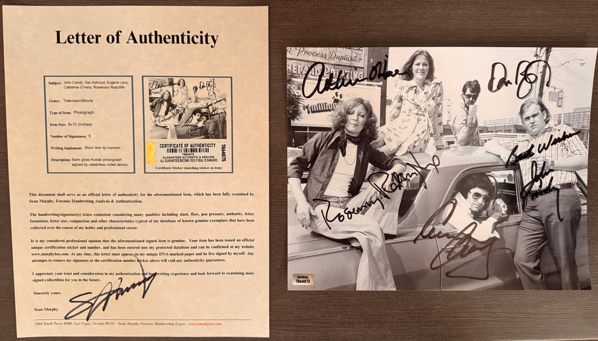 A cast autographed poster of the original SCTV actors. Signed photo of John Candy, Catherine O'Hara, Eugene Levy, Dan Aykroyd and Rosemary Radcliffe in black ink marker signatures. Photograph autographs for sale on 8x12 inch picture with COA.