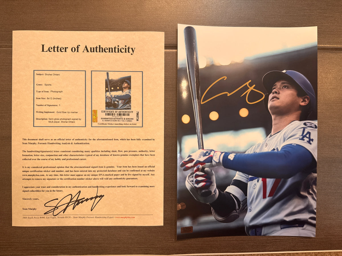 An autographed rookie rc photo poster of MLB Los Angeles Dodgers baseball player, Shohei Ohtani. Signed patch auto photo in gold ink marker signatures. Photograph Shohei Ohtani autographs for sale on 8x12 inch picture with COA.
