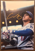 An autographed rookie rc photo poster of MLB Los Angeles Dodgers baseball player, Shohei Ohtani. Signed patch auto photo in gold ink marker signatures. Photograph Shohei Ohtani autographs for sale on 8x12 inch picture.