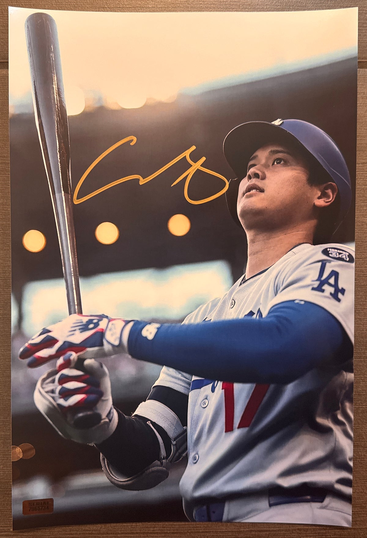 An autographed rookie rc photo poster of MLB Los Angeles Dodgers baseball player, Shohei Ohtani. Signed patch auto photo in gold ink marker signatures. Photograph Shohei Ohtani autographs for sale on 8x12 inch picture.