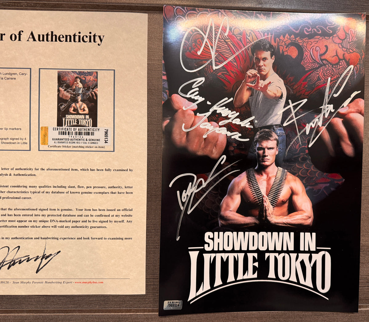 An autographed 'Showdown in Little Tokyo' movie poster autographed by Brandon Lee, Dolph Lundgren, Tia Carrerre and more. autograph in silver ink on 8x12 inch photo photograph with COA