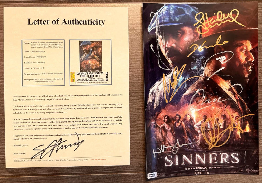 An autographed 8x12 Sinners movie photo featuring multiple signatures in gold, white, and blue ink over a dark-toned illustrated design with the film title at the bottom with COA.
