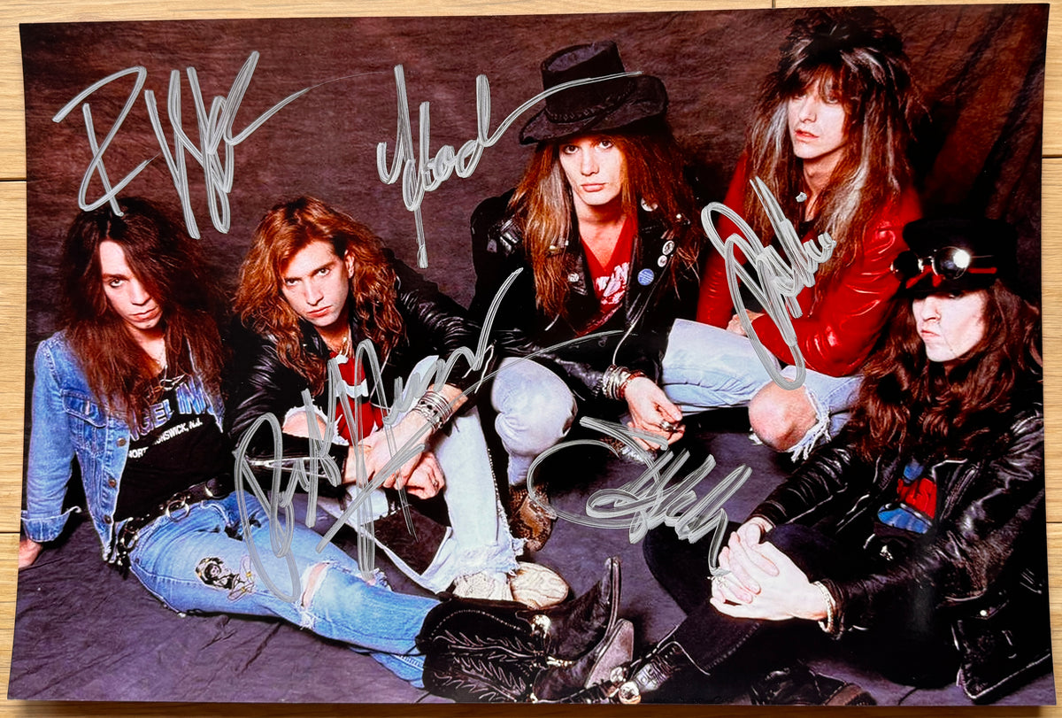 An autographed photo of the rock band Skid Row. Signed poster of Sebastian Bach, Rob Affuso, Dave Sabo, Rachel Bolan and Scotti Hil in silver ink markers. Photograph autographs for sale on 8x12 inch picture.
