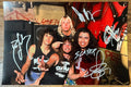 An autographed poster of the heavy metal band, Slayer. Signed photo of Tom Araya, Jeff Hanneman, Kerry King and Dave Lombardo in silver ink marker signatures. Photograph autographs for sale on 8x12 inch picture.