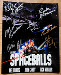 A cast autographed poster for the movie Spaceballs. Signed photo of John Candy, Mel Brooks, Bill Pullman, Rick Moranis, Daphne Zuniga and Joan Rivers in gold and silver ink marker signatures. Photograph autographs for sale on 8x12 inch picture.