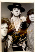 An autographed photo poster of the band, Double Trouble. Signed photo of Stevie Ray Vaughan, Chris Layton and Tommy Shannon in silver marker signatures. Photograph Stevie Ray Vaughan autographs for sale on 8x12 inch picture.

