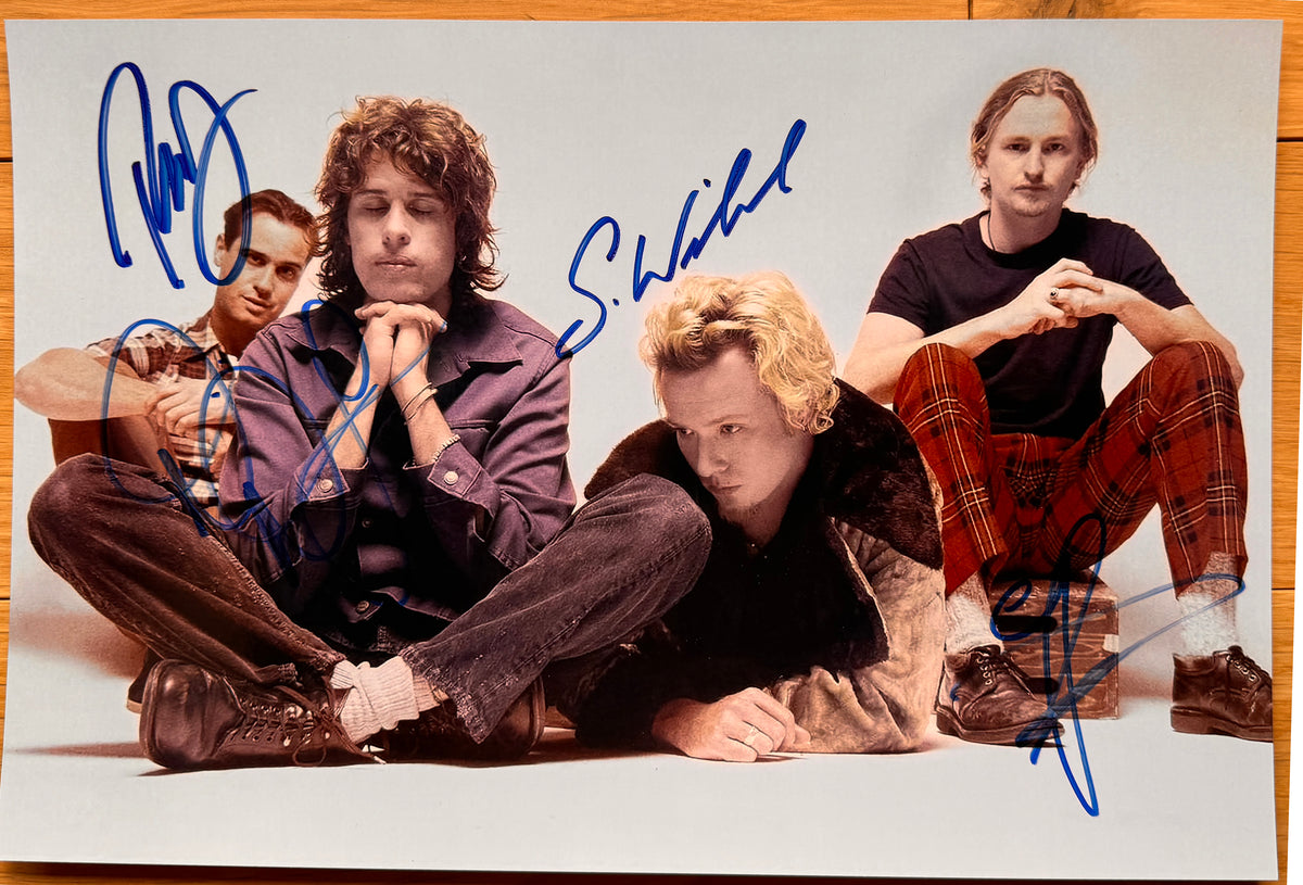 A band autographed poster of Stone Temple Pilots. Signed photo of Scott Weiland, Dean DeLeo, Robert DeLeo and Eric Kretz in blue marker ink signatures. Photograph Scott Weiland autographs for sale on 8x12 inch picture.