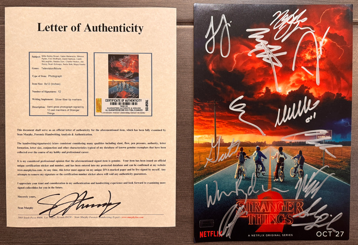 A cast autographed photo poster of the Netflix television series, Stranger Things. Signed photo of Millie Bobby Brown, Winona Ryder, David Harbour, Finn Wolfhard, Gaten Matarazzo, Noah Schnapp, Joe Keery, Caleb McLaughlin, Natalia Dyer, Charlie Heaton, Sadie Sink and Maya Hawke in silver ink signatures. Photograph Stranger Things autographs for sale on 8x12 inch picture with COA.