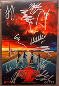 A cast autographed photo poster of the Netflix television series, Stranger Things. Signed photo of Millie Bobby Brown, Winona Ryder, David Harbour, Finn Wolfhard, Gaten Matarazzo, Noah Schnapp, Joe Keery, Caleb McLaughlin, Natalia Dyer, Charlie Heaton, Sadie Sink and Maya Hawke in silver ink signatures. Photograph Stranger Things autographs for sale on 8x12 inch picture.