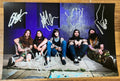 An autographed photo poster of the heavy metal band, Suicide Silence. Signed photo of Mitch Lucker, Mark Heylmun, Chris Garza, Dan Kenny and Alex Lopez in silver ink marker signatures. Photograph autographs for sale on 8x12 inch picture.