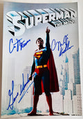 A cast autographe poster of the 1978 superhero movie, Superman The Movie. Signed photo of Christopher Reeve, Gene Hackman and Margot Kidder in blue ink marker signatures. Photograph autographs for sale on 8x12 inch picture.
