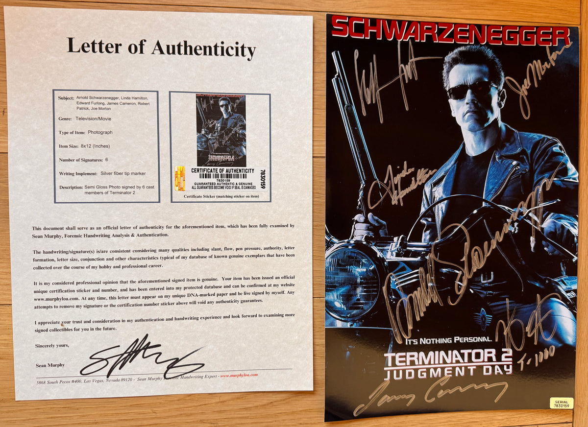 An autographed 8x12 movie photo for Terminator 2: Judgment Day featuring Arnold Schwarzenegger on a motorcycle, with multiple silver signatures across the image with COA.