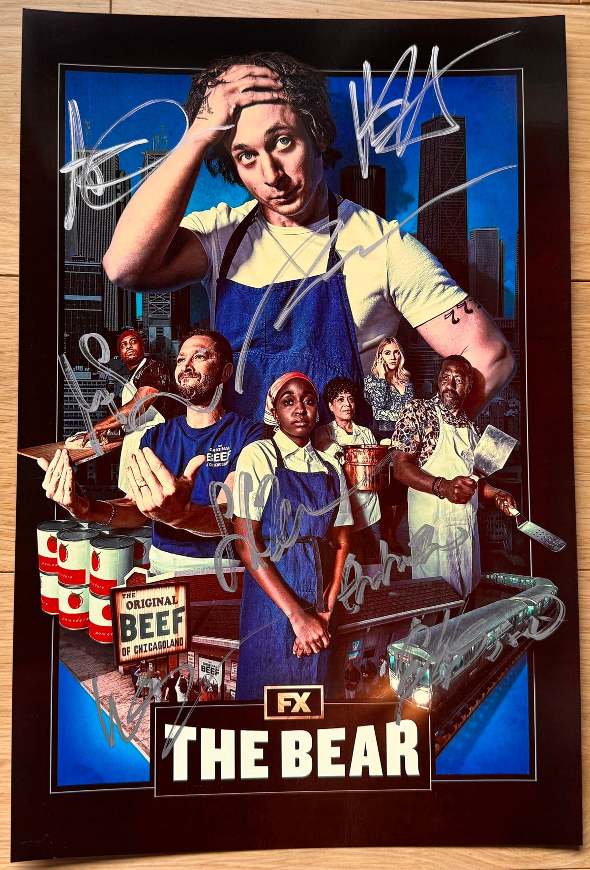A cast autographed photo poster of the TV show 'The Bear'. Signed photo by Jeremy Allen White, Ebon Moss-Bachrach, Ayo Edebiri, Lionel Boyce, Liza Colón-Zayas, Abby Elliott, Matty Matheson and Edwin Lee Gibson in silver ink markers signatures. Photograph The Bear autographs for sale on an 8x12 inch picture.