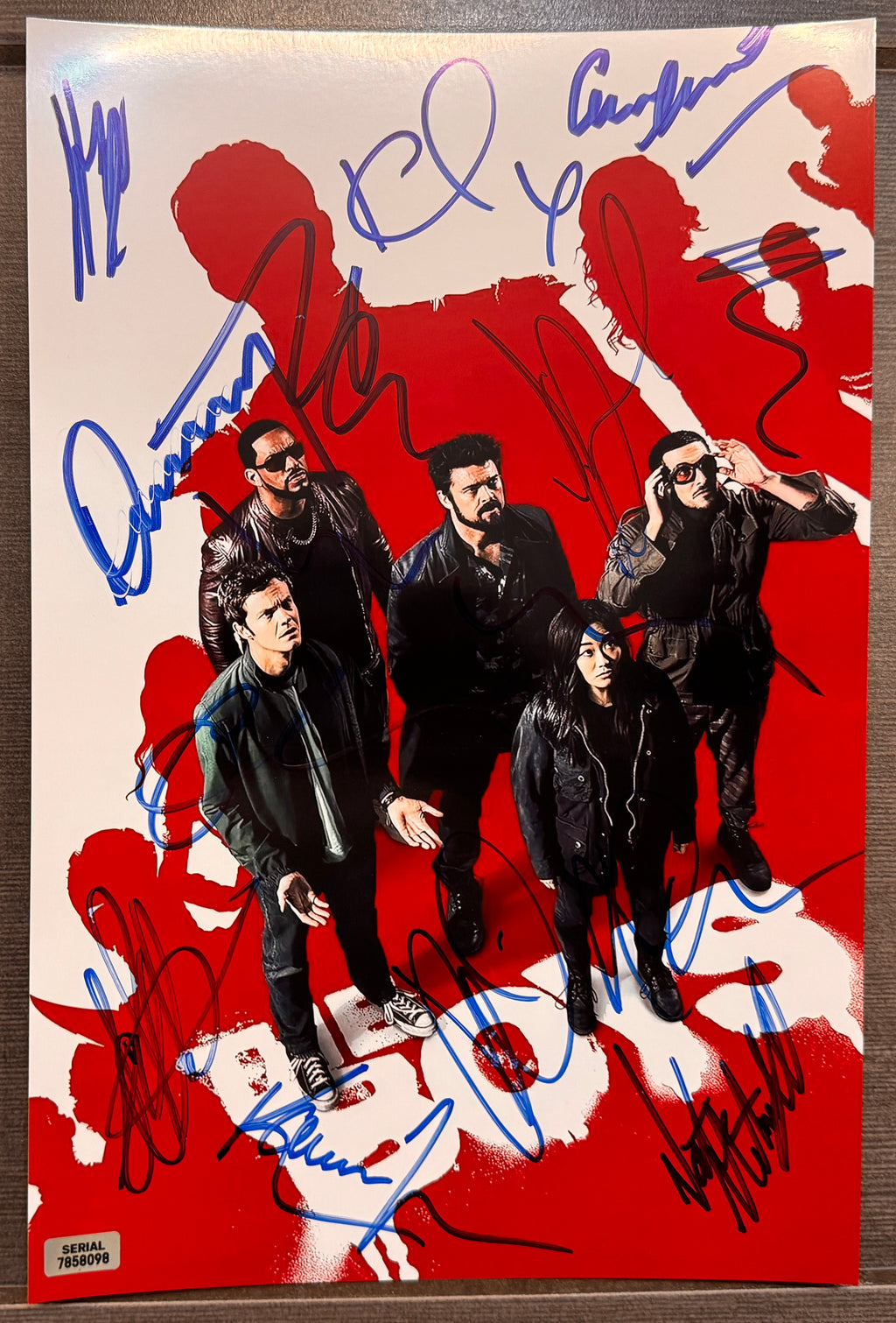 An autographed poster of the television series, The Boys. Signed photo of Karl Urban, Jack Quaid, Antony Starr, Erin Moriarty, Dominique McElligott, Jessie T. Usher, Laz Alonso, Chace Crawford, Tomer Capon, Karen Fukuhara, Nathan Mitchell and Colby Minifie in blue ink markers. Photograph autographs for sale on 8x12 inch picture.