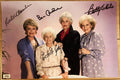 A cast autographed poster of the television show, The Golden Girls. Signed photo of Bea Arthur, Betty White, Rue McClanahan and Estelle Getty in black ink markers signatures. Photograph autographs for sale on 8x12 inch picture.