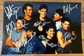 An autographed photo of the movie The Outsiders. signed photograph of Patrick Swayze, Tom Cruise, Rob Lowe, Matt Dillon, Ralph Macchio, Thomas C. Howell and Emilio Estevez in silver ink marker signatures. poster is 8x12 inches in size. Autographs for sale.