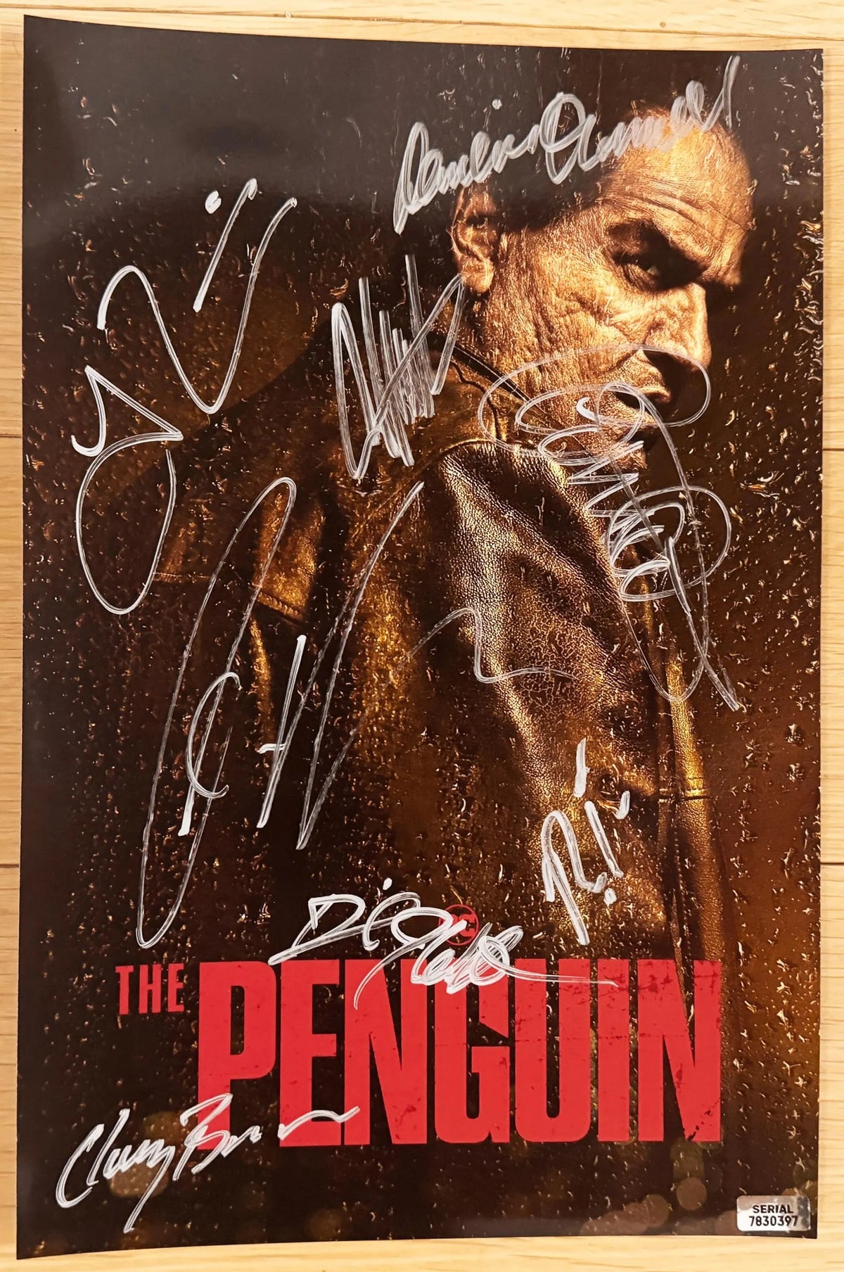 A cast autographed 'The Penguin' movie photo poster. Signed photo by Colin Farrell, Cristin Milioti, Rhenzy Feliz, Deirdre O'Connell, Carmen Ejogo, Theo Rossi, Clancy Brown and Daniel J. Watts in silver ink markers signatures. Photograph The Penguin autographs for sale on 8x12 inch picture.