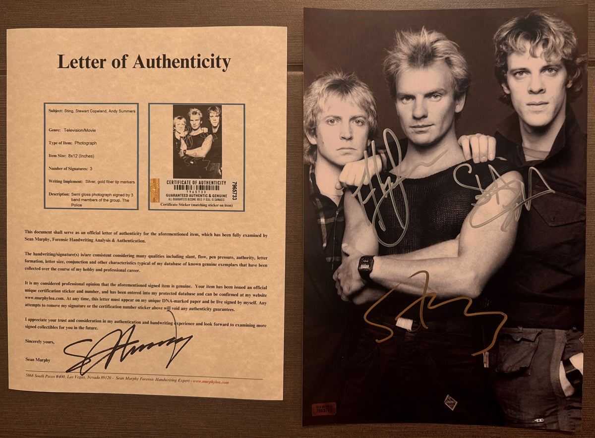An autographed photo poster of the rock band, The Police. Signed photograph of Sting, Stewart Copeland and Andy Summers in silver and gold ink marker signatures. Photograph The Police autographs for sale on 8x12 inch picture with COA.