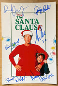 A cast autographed photo poster of the Christmas movie, The Santa Clause. Signed photo of Tim Allen, Wendy Crewson, Judge Reinhold, Eric Lloyd and David Krumholtz in blue ink markers signatures. Photograph The Santa Clause autographs for sale on 8x12 inch picture.