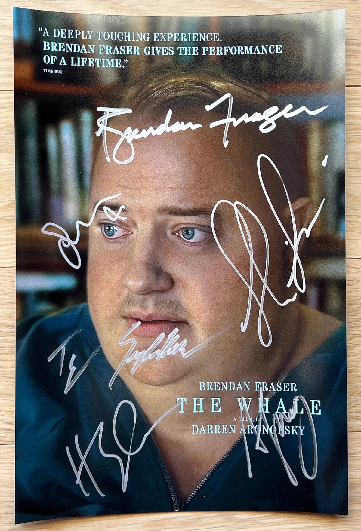 A cast autographed photo poster from the movie, The Whale. Signed photo of Brendan Fraser, Sadie Sink, Ty Simpkins, Hong Chau, Samantha Morton and Darren Aronofsky in silver ink marker signatures. Photograph autographs for sale on 8x12 inch picture.