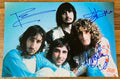 An autographed photo poster of the rock band The Who. Signed poster of Roger Daltrey, Pete Townshend and John Entwistle in blue ink markers signatures. Photograph The Who autographs for sale on 8x12 inch picture.