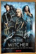 A cast autographed photo poster of the netflix television series, The Witcher. Signed photo of Henry Cavill, Freya Allan, Anya Chalotra, Mimi Ndiweni, Eamon Farren and Joey Batey in silver and gold ink marker signatures. Photograph autographs for sale on 8x12 inch picture.