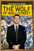 A cast autographed poster of the movie The Wolf of Wall Street. Signed photo of Leonardo DiCpario, Margot Robbie, Jonah Hill, Martin Scorsese, Jon Bernthal and Matthew McConaughey in blue ink marker signatures. Photograph autographs for sale on 8x12 inch picture.