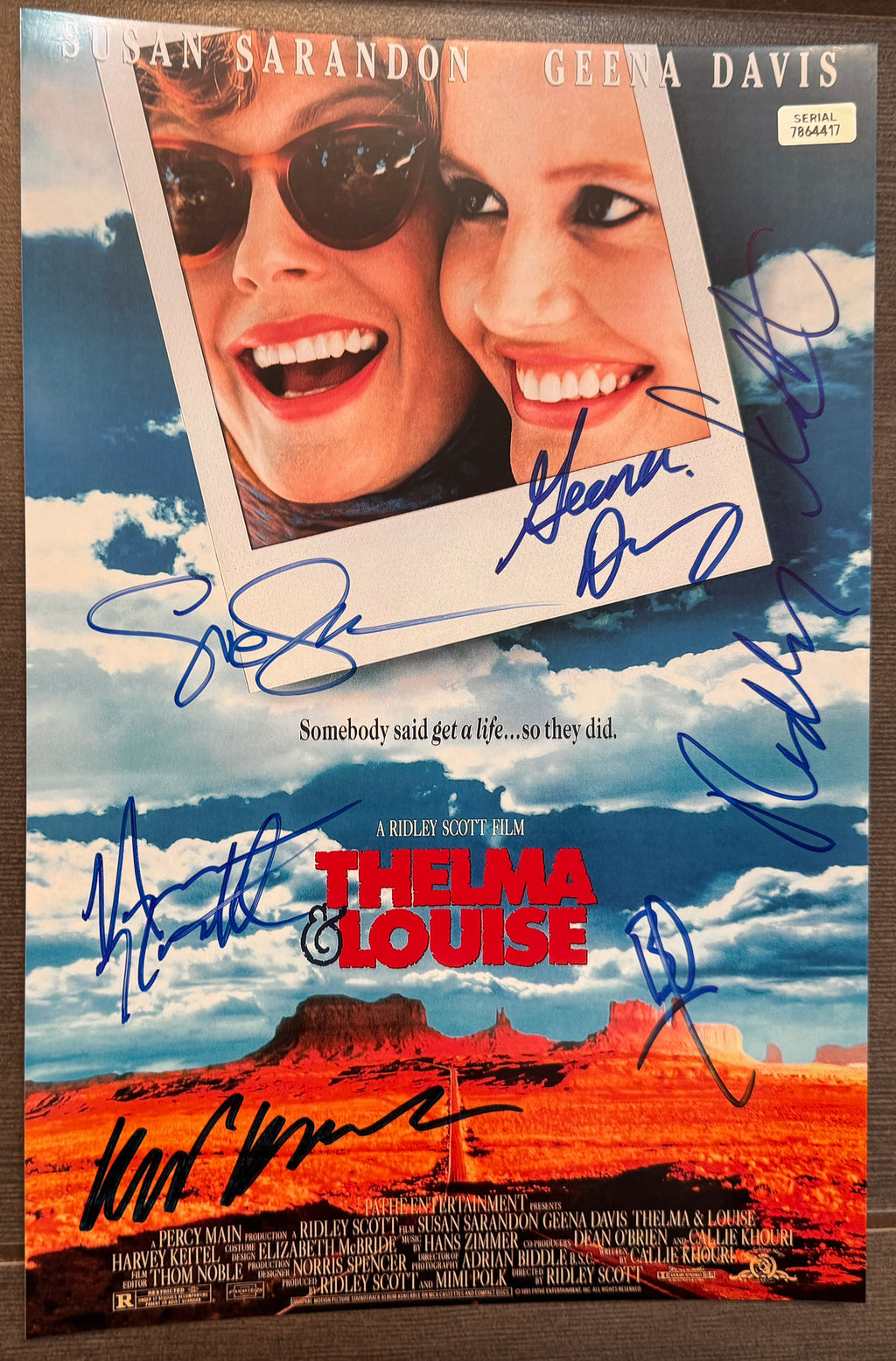 A cast autographed movie photo poster for the film 'Thelma & Louise' also known as Thelma and Louise. signed photograph by Susan Sarandon, Geena Davis, Harvey Keitel, Brad Pitt, Michael Madsen and Ridley Scott in blue ink marker signatures. photograph thelma & louise autographs for sale on picture.