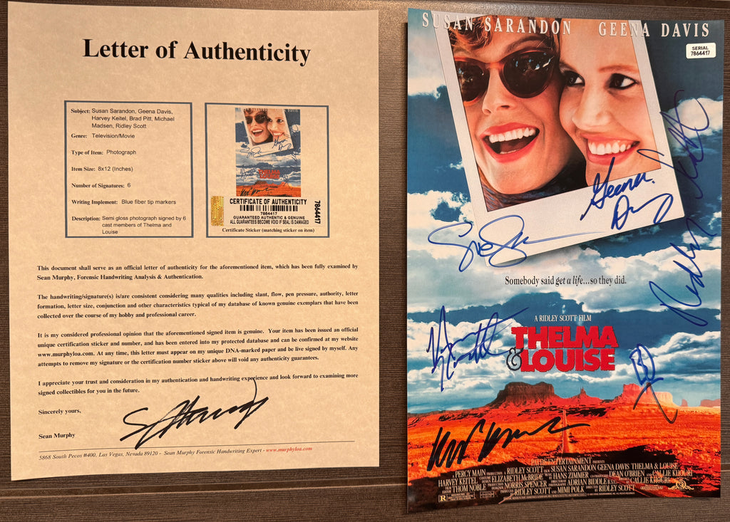 An autographed movie poster for the film 'Thelma & Louise' also known as Thelms and Louise. signed photograph by Susan Sarandon, Geena Davis, Harvey Keitel, Brad Pitt, Michael Madsen and Ridley Scott in blue ink. photo autographs for sale with COA.